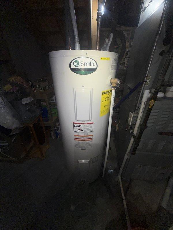 Responded to complete plumbing installation following HVAC technician's saddle ball valve work on A.O. Smith tanked water heater. Connected and secured copper piping assembly with proper fittings, applied insulation wrap to exposed sections, and verified all connections for proper water flow and leak prevention. System tested and confirmed operational with no active leaks detected at completion.