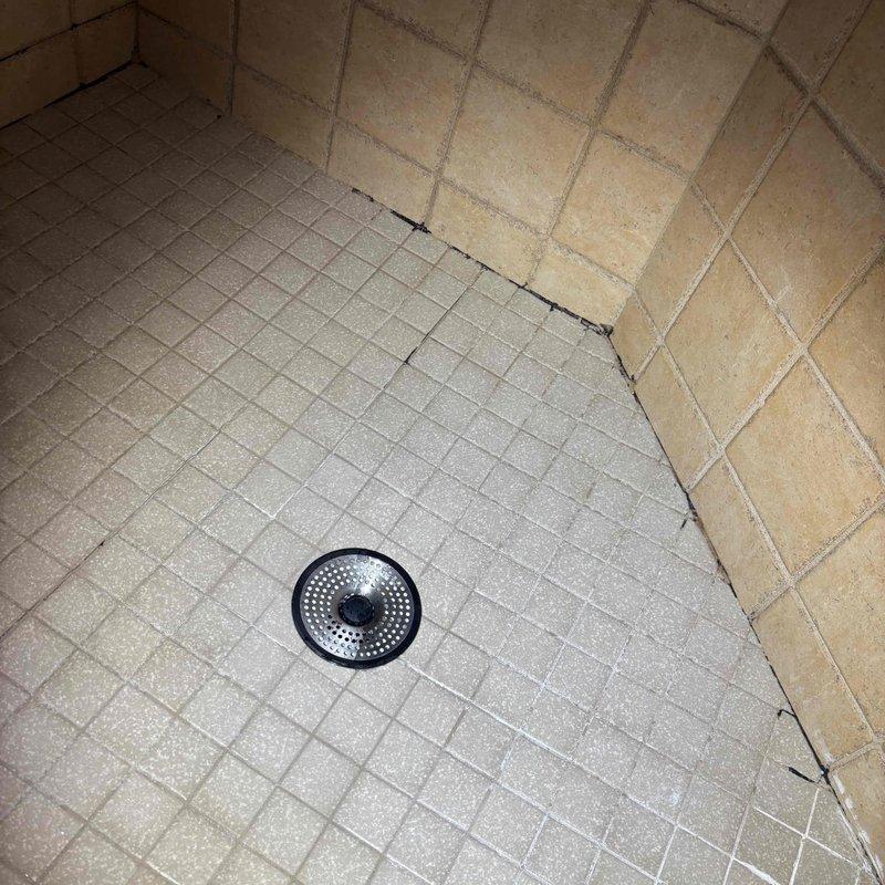 Completed comprehensive whole home plumbing inspection including all fixtures, water supply lines, drain systems, and water heater. Performed requested sump pump evaluation to verify proper operation and float switch functionality. Documented shower floor drain conditions with photographic evidence showing tile separation near drain assembly and potential grout deterioration requiring monitoring for water intrusion issues.