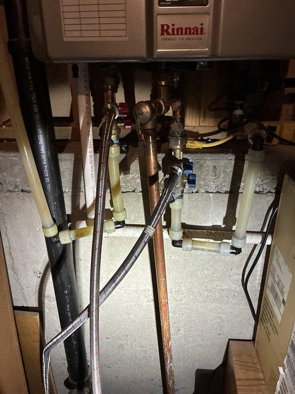 Completed preventive plumbing maintenance on single-unit Rinnai tankless water heater system. Inspected all plumbing connections, copper piping, flexible stainless steel supply lines, and shut-off valves for proper operation and potential leaks. Verified HVAC integration components, drainage collection system, and mounting hardware integrity. All equipment found to be functioning within normal parameters.