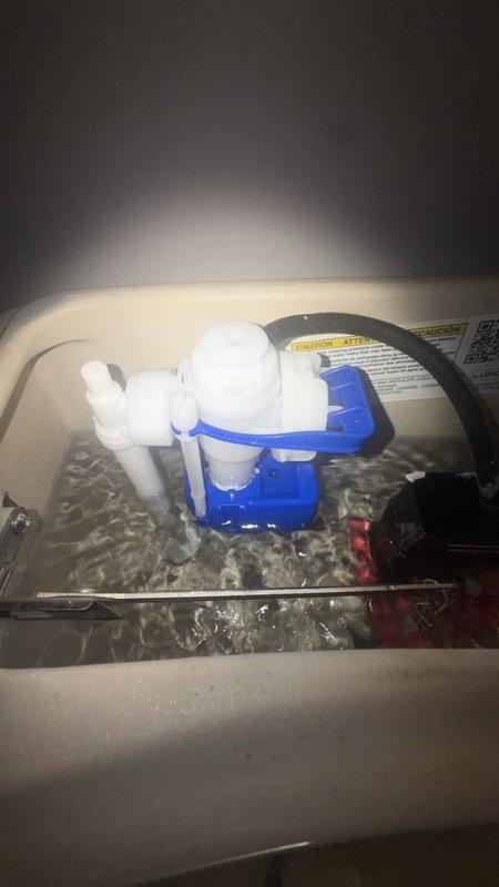 Responded to service call for two malfunctioning toilets in main bathrooms. First toilet exhibited continuous running condition due to faulty fill valve assembly. Inspected tank components and identified worn flapper seal and improperly adjusted float mechanism causing constant water flow. Second toilet produced loud noise during and after flushing, traced to defective fill valve creating water hammer effect. Removed tank lids on both units for diagnostic inspection. Documented existing flush valve assemblies, float ball valve systems, and internal tank mechanisms via photographs. Addressed both issues by adjusting float heights, checking flush valve seals, and ensuring proper water pressure regulation to eliminate running water and noise concerns.