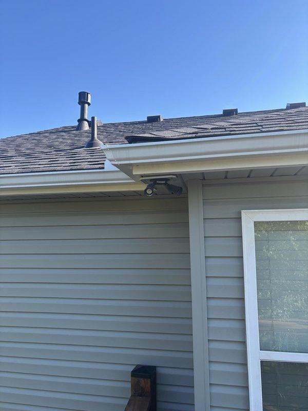 Responded to reported leak with unknown source location. Conducted thorough exterior inspection of residential property, examining roof penetrations, plumbing vents, gutter system, and ground-level drainage components. Located and documented potential water intrusion points including roof stack penetrations and exterior PVC drainage discharge at foundation level for customer awareness and future repair planning.