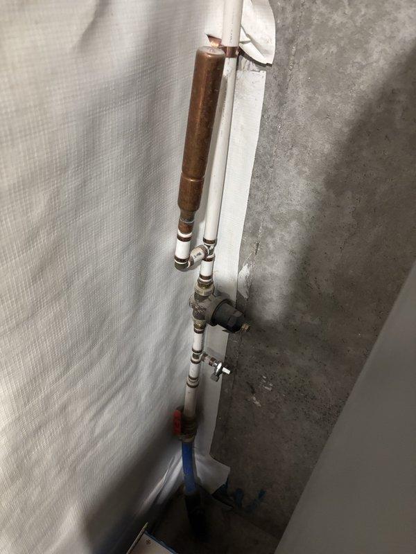 Performed comprehensive plumbing inspection and documentation of residential water supply system. Evaluated copper-to-PVC transition piping with oxidized copper sections, verified shut-off valve functionality, and inspected under-sink P-trap assembly with supply line connections to ensure proper drainage and water supply operation.