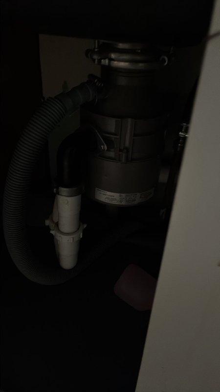 Installed under-sink water treatment system in kitchen area. Connected treatment unit to existing plumbing configuration, integrating with P-trap assembly and disposal unit drainage system. Verified proper flow and secure mounting of all components.