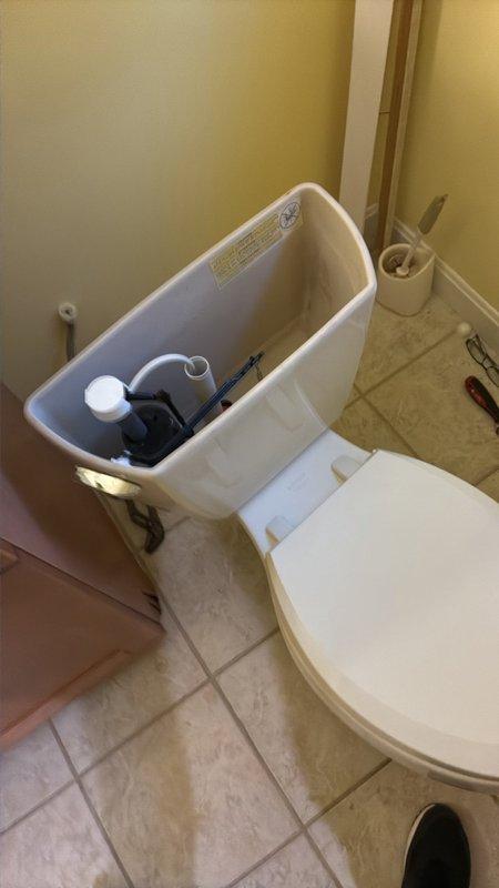Responded to service call for toilet installation in master bathroom. Customer supplied new toilet unit for replacement. Removed existing toilet, exposing floor flange and drain connection. Inspected flange condition and verified proper seal capability. Installed customer-provided toilet, connecting to existing brass floor flange and water supply line. Adjusted tank components including flapper valve, fill valve assembly, and float mechanism to ensure proper flush operation. Tested for leaks at base seal and water supply connection. Verified stable mounting and proper bowl drainage.