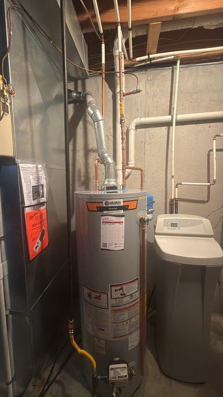 Installed a new 50-gallon tanked water heater with expansion tank in basement utility area. Completed all copper piping connections to hot and cold water supply lines, installed proper shut-off valves, and connected gas line and exhaust venting. All work performed to code specifications with system tested and operational upon completion.