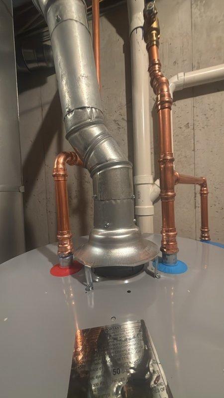 Installed a new 50-gallon tanked water heater with expansion tank in basement utility area. Completed all copper piping connections to hot and cold water supply lines, installed proper shut-off valves, and connected gas line and exhaust venting. All work performed to code specifications with system tested and operational upon completion.