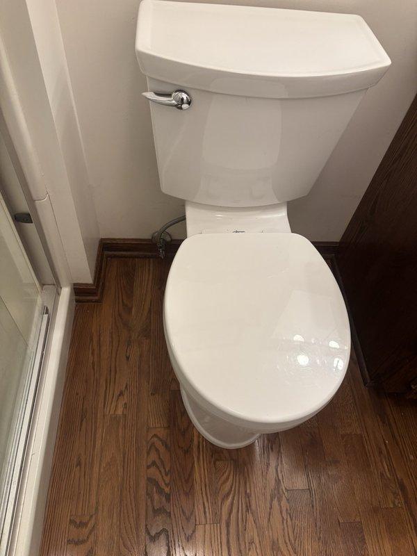 Responded to report of constantly running toilet in master bathroom. Upon inspection, identified American Standard 4215A model with faulty fill valve assembly causing continuous water flow into tank. Disassembled tank lid and diagnosed worn internal components within fill valve mechanism preventing proper water shutoff. Replaced defective fill valve assembly with new unit, adjusted float height and refill tube positioning to manufacturer specifications. Tested flush cycle multiple times to verify proper tank fill, shutoff function, and bowl refill operation. Toilet now functioning correctly with no continuous running or water waste.