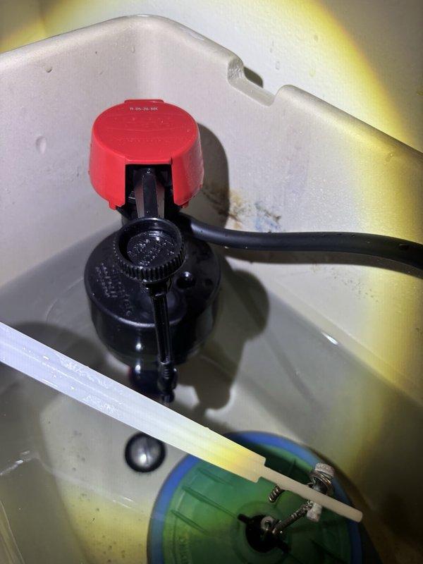 Responded to report of constantly running toilet in master bathroom. Upon inspection, identified American Standard 4215A model with faulty fill valve assembly causing continuous water flow into tank. Disassembled tank lid and diagnosed worn internal components within fill valve mechanism preventing proper water shutoff. Replaced defective fill valve assembly with new unit, adjusted float height and refill tube positioning to manufacturer specifications. Tested flush cycle multiple times to verify proper tank fill, shutoff function, and bowl refill operation. Toilet now functioning correctly with no continuous running or water waste.