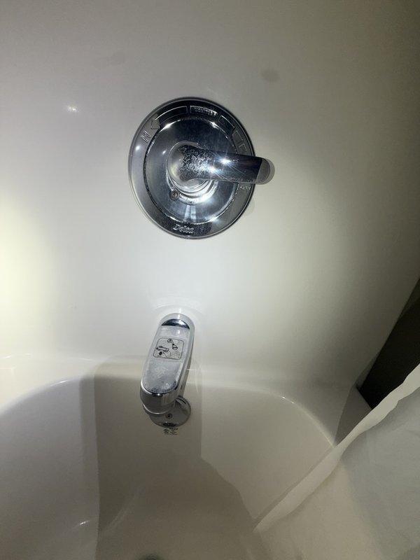 Performed preventive plumbing maintenance including complete system inspection of fixtures and components. Conducted tankless water heater flush as part of membership service to remove mineral buildup and maintain optimal performance. Inspected bathroom plumbing fixtures including chrome shower control valve, bathtub spout with diverter mechanism, and associated trim components, confirming proper operation. Verified internal tankless water heater components including circuit board, wiring harnesses, and heating elements were functioning correctly. All fixtures and equipment found in good working condition with no leaks or operational issues identified.