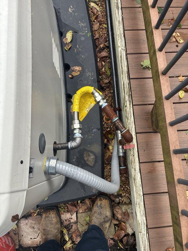 Replaced a section of corroded black iron gas piping running from the deck to the standby generator with the customer-supplied flexible gas connector furnished with the generator, installing it with the gas shutoff valve in place. Connections were made at the threaded fittings and the line was prepared for leak testing and verification of the generator supply. Also assessed the exterior spigot and provided an estimate for its replacement.