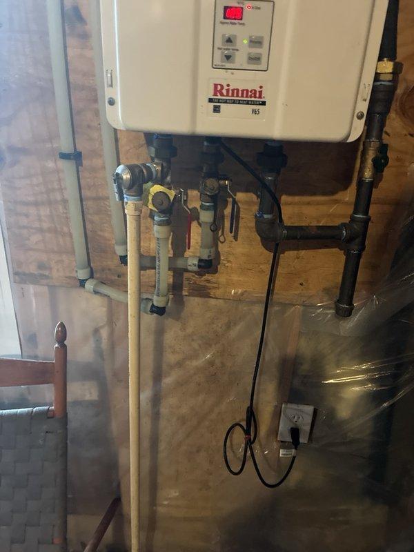 Performed scheduled plumbing maintenance on the Rinnai tankless water heater, including a descaling flush of the heat exchanger through the service valves. Inspected the whole-home water filter housing and its supply piping and fittings, and replaced the filter cartridge as part of routine maintenance. Replaced the humidifier filter, and all systems were left in proper working order.