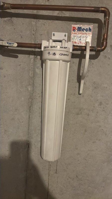 Performed scheduled plumbing maintenance on the Rinnai tankless water heater, including a descaling flush of the heat exchanger through the service valves. Inspected the whole-home water filter housing and its supply piping and fittings, and replaced the filter cartridge as part of routine maintenance. Replaced the humidifier filter, and all systems were left in proper working order.
