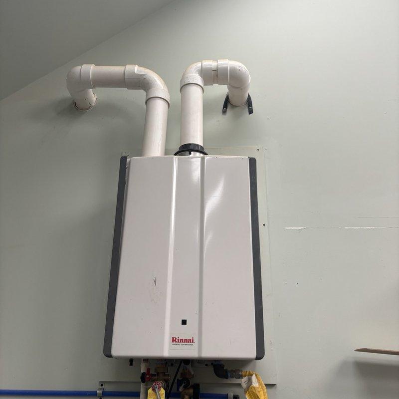 Serviced a Rinnai tankless water heater reported to be underperforming, inspecting the unit, gas and water connections, and venting, and restoring proper heating operation. Addressed the non-functioning recirculating pump and the inoperative bidet supply, then verified hot water delivery and normal system operation at the utility sink faucet.