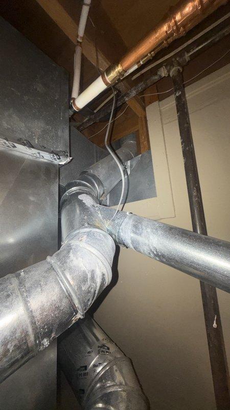 Replaced the main water shutoff valve at the water main and re-piped a leaking fitting on the water heater supply line. Installed new copper piping and pressed fittings, restored water service, and pressure-tested the connections to confirm leak-free operation.