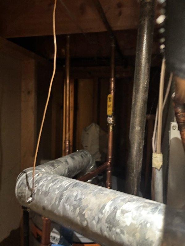 Installed a new 40-gallon gas water heater in the utility closet, with a thermal expansion tank mounted and secured on the supply line to manage pressure fluctuations. Connected the copper supply piping and shutoff valve, then reconnected the gas line and the galvanized flue vent, leaving the unit securely installed and all connections in place.
