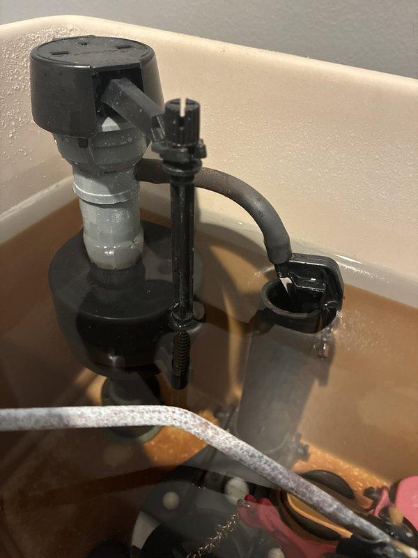 Diagnosed a continuously running toilet and found worn internal tank components, including a deteriorated flapper and fill valve, with heavy mineral staining and sediment in the tank. Replaced the fill valve and both flappers, adjusted the float and refill tube to set the proper water level, and verified the overflow tube was correctly positioned. Tested multiple flush cycles to confirm the toilet fills, shuts off completely, and holds water without leaking.