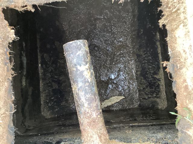 
I went to a mobile home park in Dudley to check the condition of some septic tanks. I found that this one needed to be pumped out and the septic system was not in good condition.