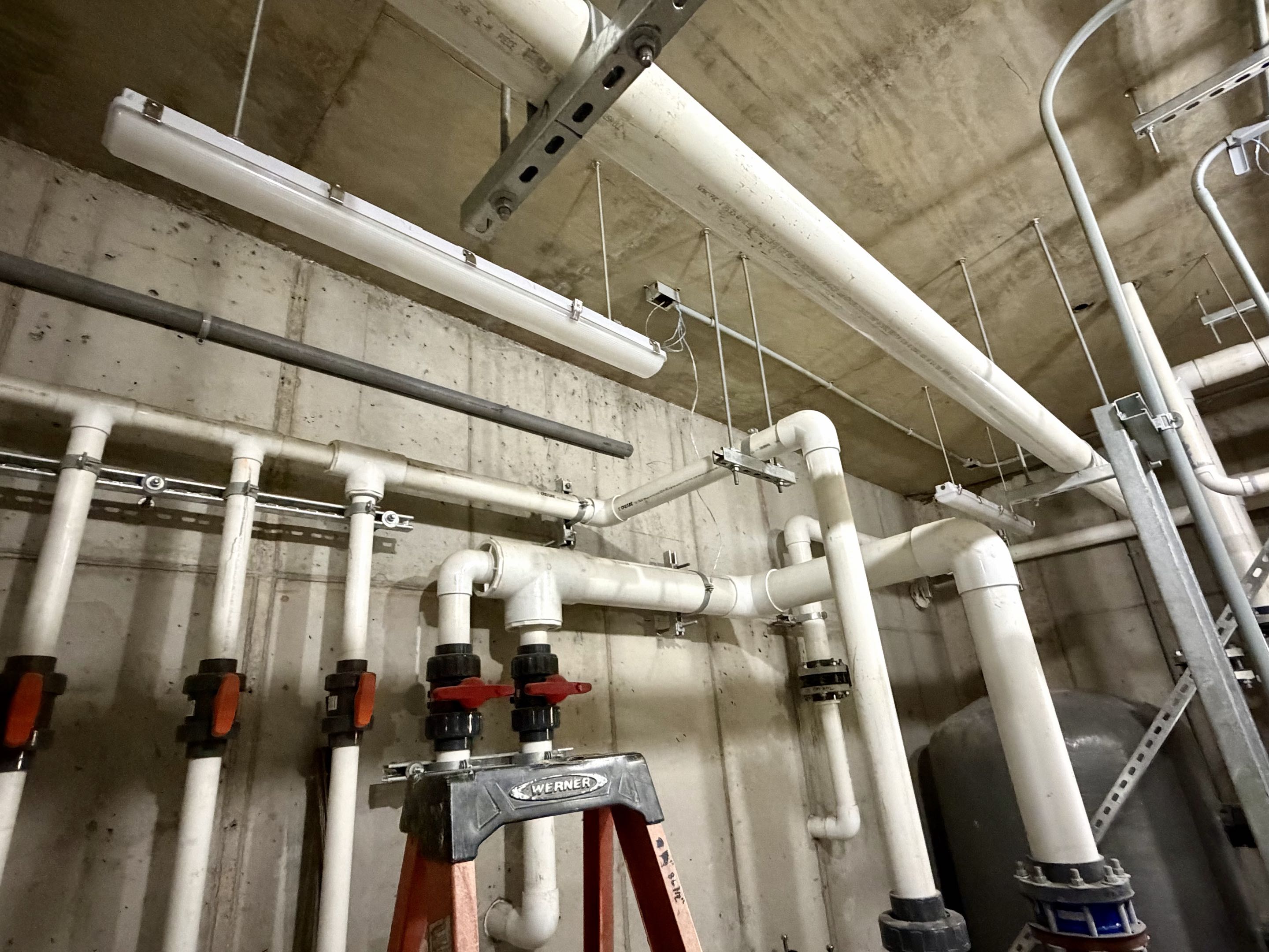Starting the light fixture install in the basement at Massanutten Waterpark Expansion 