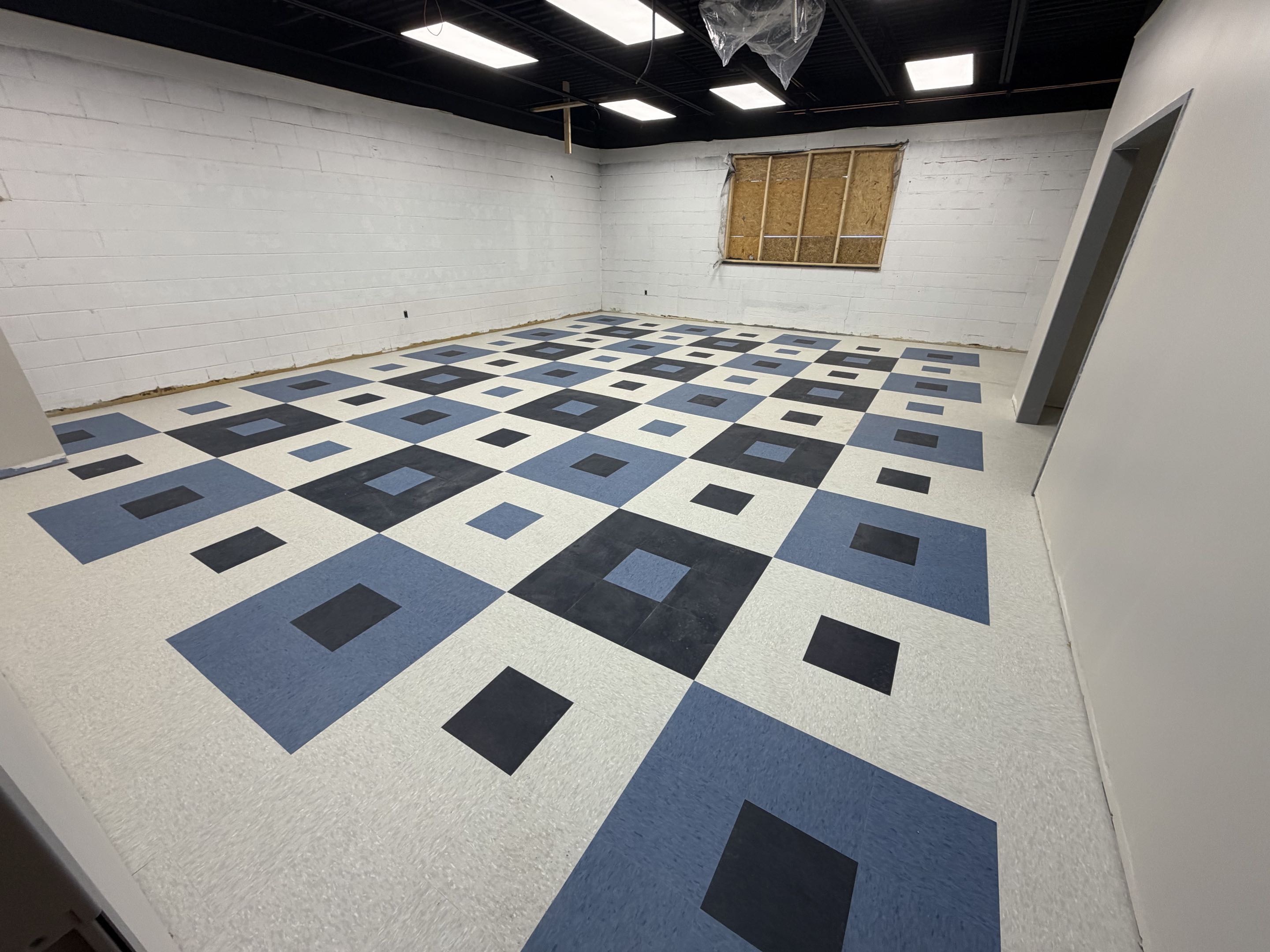 Lights are burning. Receptacles are hot. First coats of paint being applied. Brand new floor tile going in. Great overall progress as a project. 