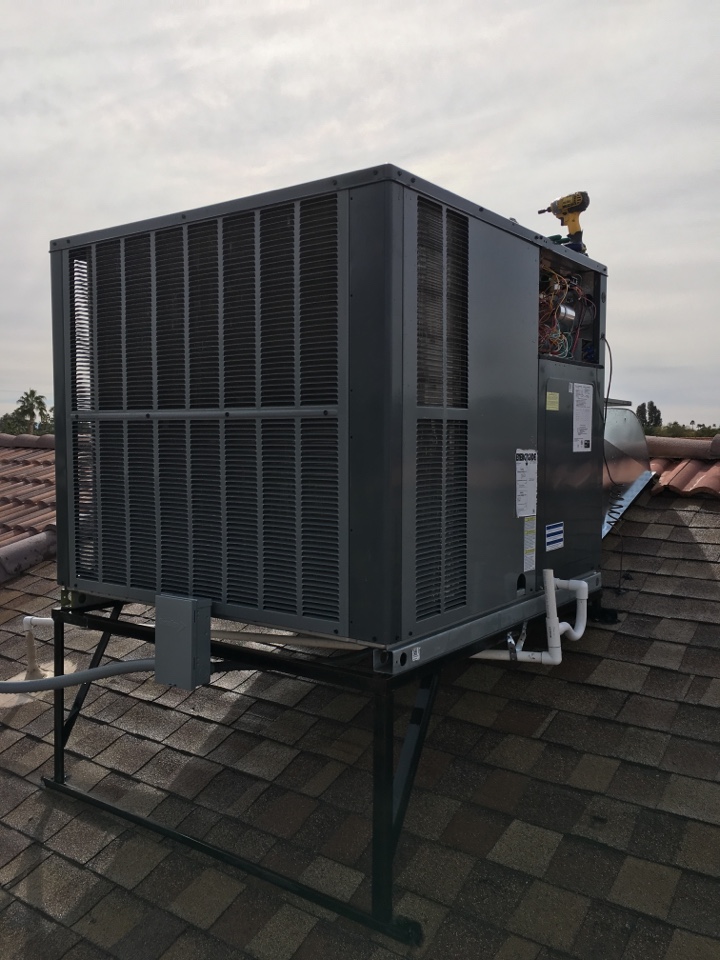 Performing heating/cooling maintenance on 16 seer Amana package heat pump in SunLakes Arizona 