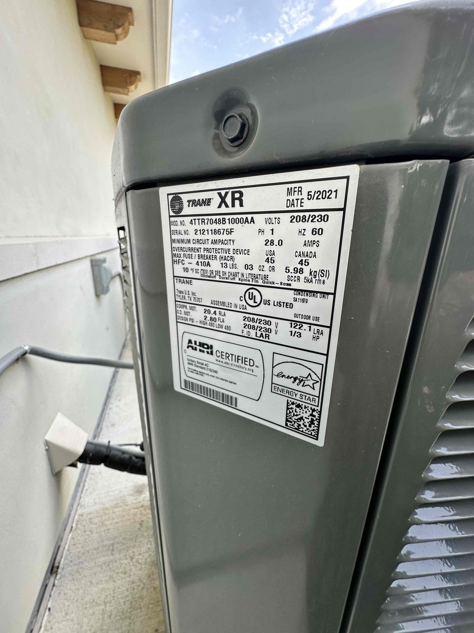 Upon arrival, I found that the capacitor for the downstairs unit was bloated. This is a sure indication that the capacitor has failed. I replaced the failed capacitor and tested the unit. The system is fully operational with no other concerns. The upstairs unit was operating and the refrigerant pressures were good. I noticed that the unit had a bunch of build up causing the unit to not be able to exhaust the heat properly. I performed a chemical cleaning and now the unit is cooling properly. 