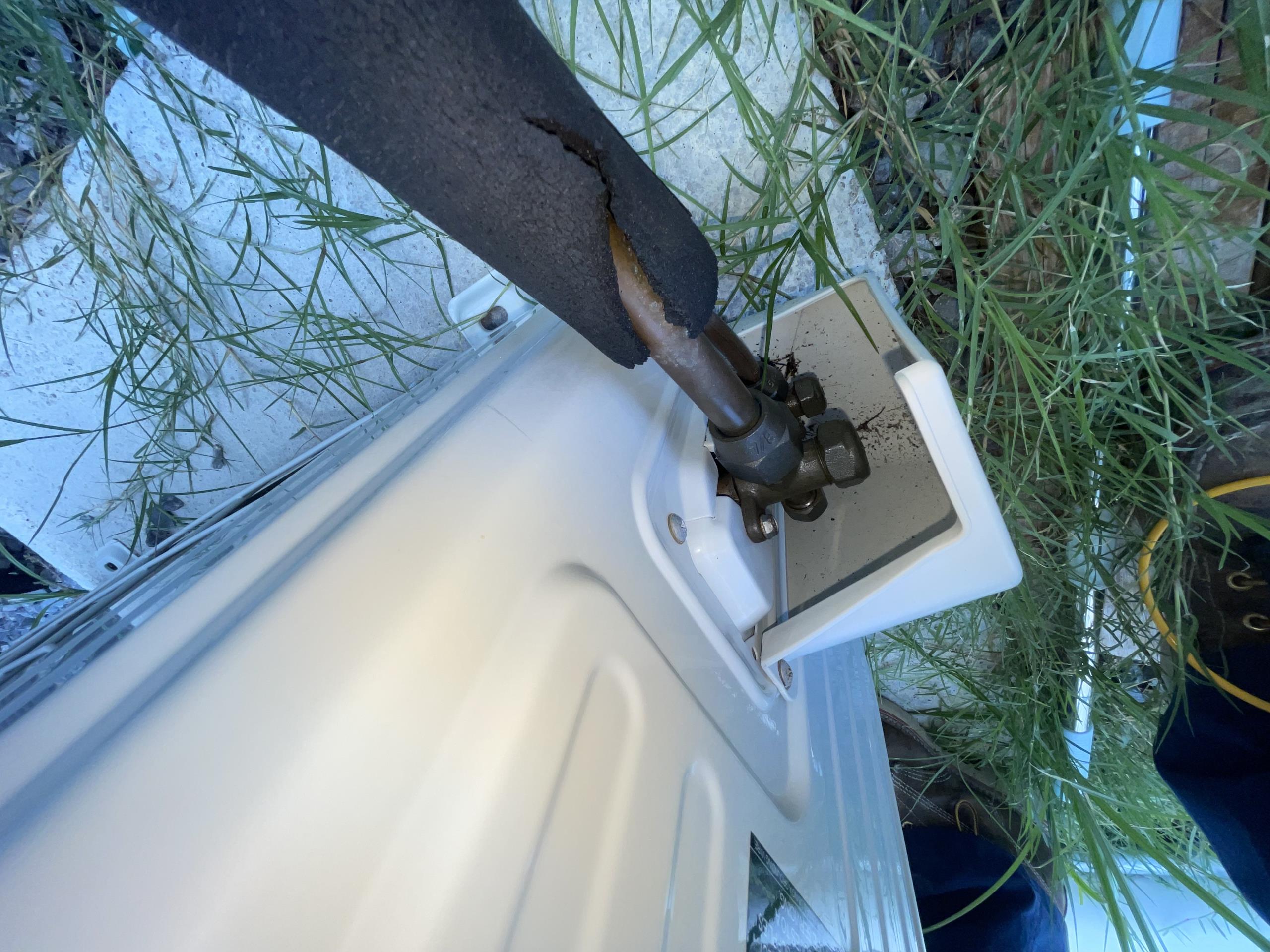 Found oil residue on flare fitting connection on the outdoor condenser. Took a leak detector and confirmed it was refrigerant. Also proceeded inside to check around the indoor unit and did not get any readings. 
We will return on Tuesday to complete the work