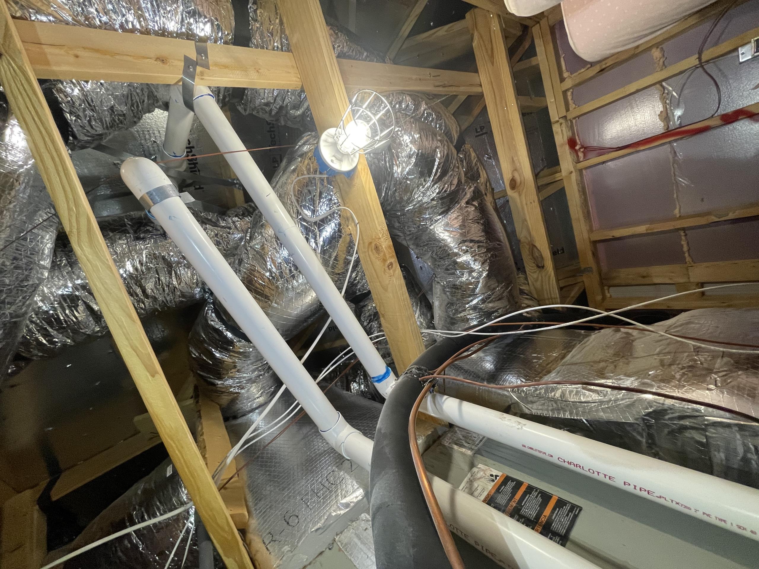 I arrived at our clients home due to air balance concerns. Mrs Perez showed me the rooms that she had concerns over. The downstairs bedrooms were not getting enough airflow while the upstairs bathroom and other vents were getting too much airflow. 
I proceeded into the upper attic area of the home and first verified that the ductwork had manual dampers which would allow for adjustments to be made. All runs do have dampers. 
I then noticed the existing bypass damper to have several tight bends which would actually restrict the airflow. 
I further confirmed that the existing 5 ton unit is undersized for the 2800sq ft home. 
I presented all of my findings to our client and we discussed adding an additional supply run and vent that would not be attached to either zones. This would allow for airflow over the loft and living room space and simultaneously alleviating the airflow for the upstairs zone. 
With this new supply run we could also do a full system airflow adjustment and restrict oth