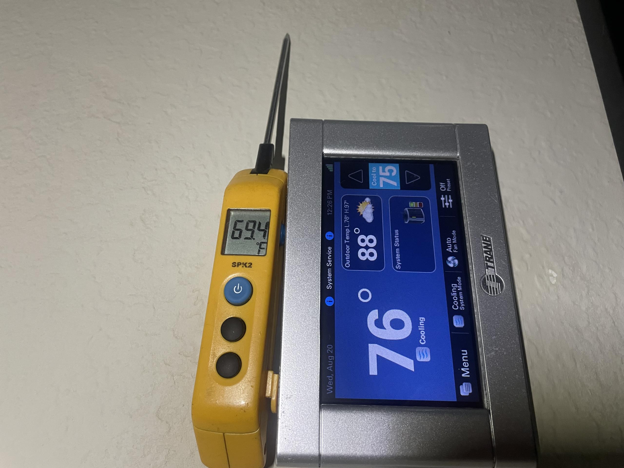 Returned to our clients home to top of system with refrigerant. I had to wait about an hour for the rain to clear. Once cleared I proceeded to charge the unit with Freon. Once charged I took temperature measurements and ensured the system was cooling wit a 20º drop. The upstairs thermostat displayed an indoor temperature of 80º which I ensured with my temperature probe and found to be incorrect. I removed the thermostat and filled in the hole with some foam insulation. I also removed the plastic flowers that were covering the thermostat. I informed our clients that we cannot have the flowers covering the thermostat and before leaving the thermostat had settled to 76º. Paul also elected to replace the filter for the upstairs unit today. The system is cooling properly on departure.