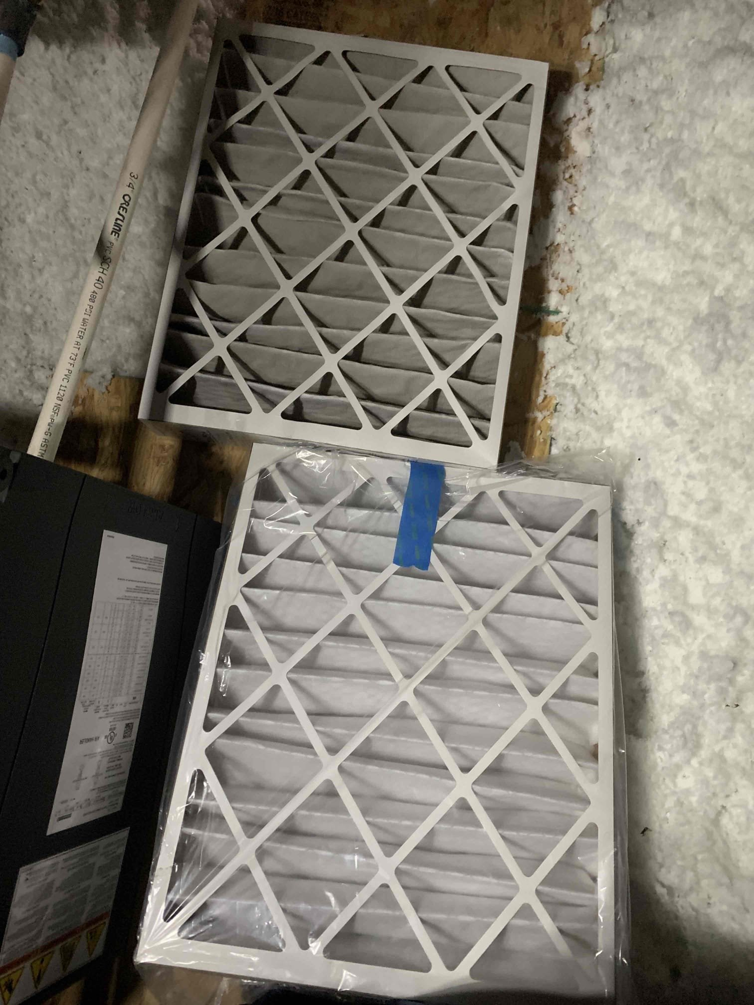 Arrived on site, and found water dripping out of emergency drain line. Upon inspecting the attic unit, I found water in the drain pan. Outside I found the drain line was run into an irrigation box a little too deep. Upon lifting the drain line a little out of the water, water immediately began draining out. Made drain line adjustments to shorten the pvc going into the drainage box to allow overflow. 20 degree split across the coil was measured with a 53 degree supply. Extensively tested drain line to ensure the line was clear and found it to be draining fine at this time. Unit in good working order upon departure.