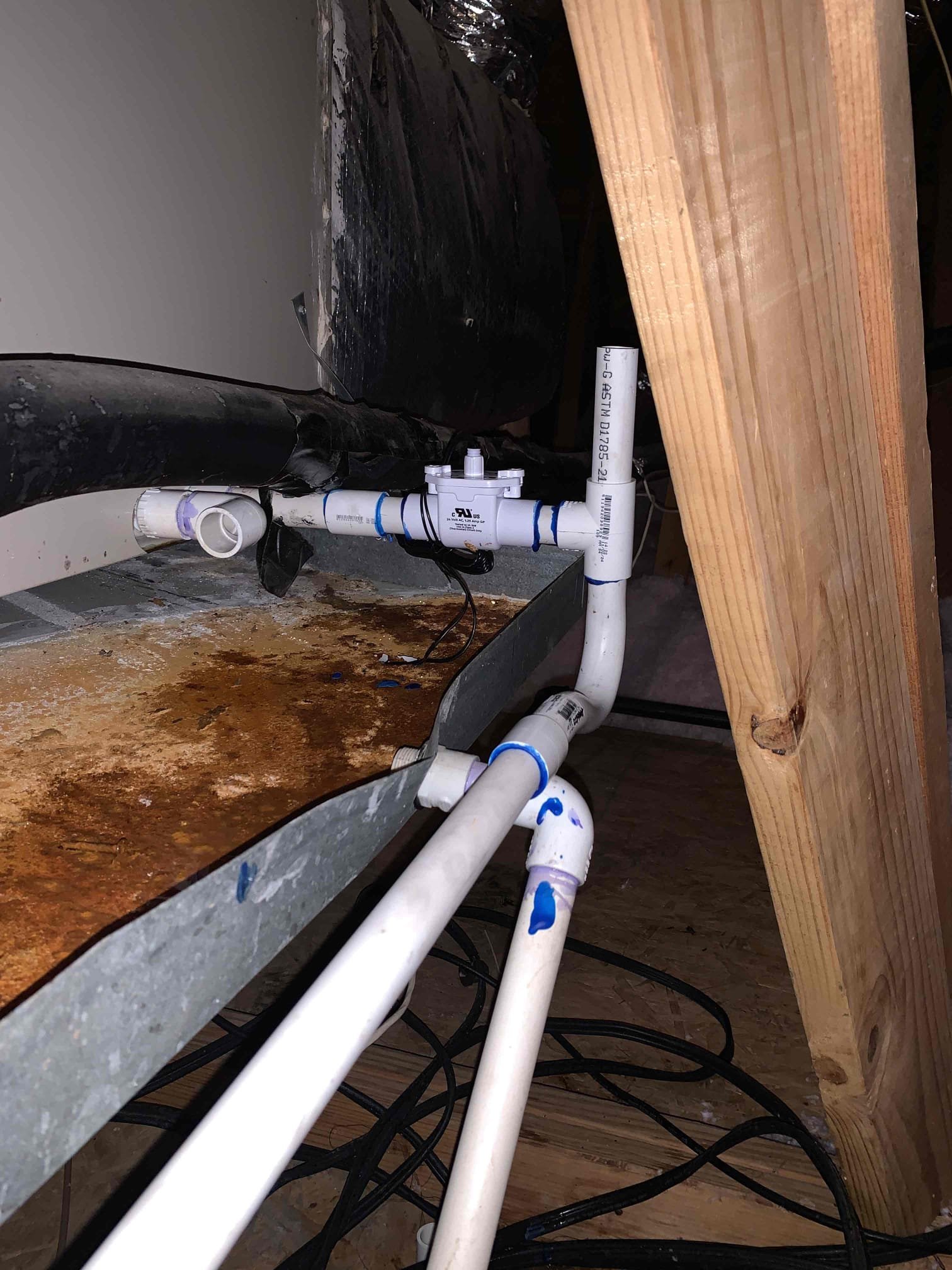 Arrived on site, homeowner notified me that water was coming out of the emergency drain lines on both sides of the house. Upon further inspection, I found that the drain lines were tied together draining in the upstairs bathroom. I removed the pvc that tied the drain line into the sink and replaced it with plastic tubing. We then installed blowout valves on both sides of the pipe so that we could isolate the drain. I proceeded to blowout the drain line and removed a substantial amount of sediment and algae. I then flushed and blew out the drain line repeatedly until the drain began to drain normally. We then installed and wired float switches to both units and tested them to make sure they were functioning properly. Tested extensively with additional water to ensure both sides are draining well and found them to be. We then proceeded to perform the maintenance.
 1. Visually inspected condenser coil for debris/ dirty.
2. Inspected condenser fan motor.
3. Inspected condenser fan blades.
