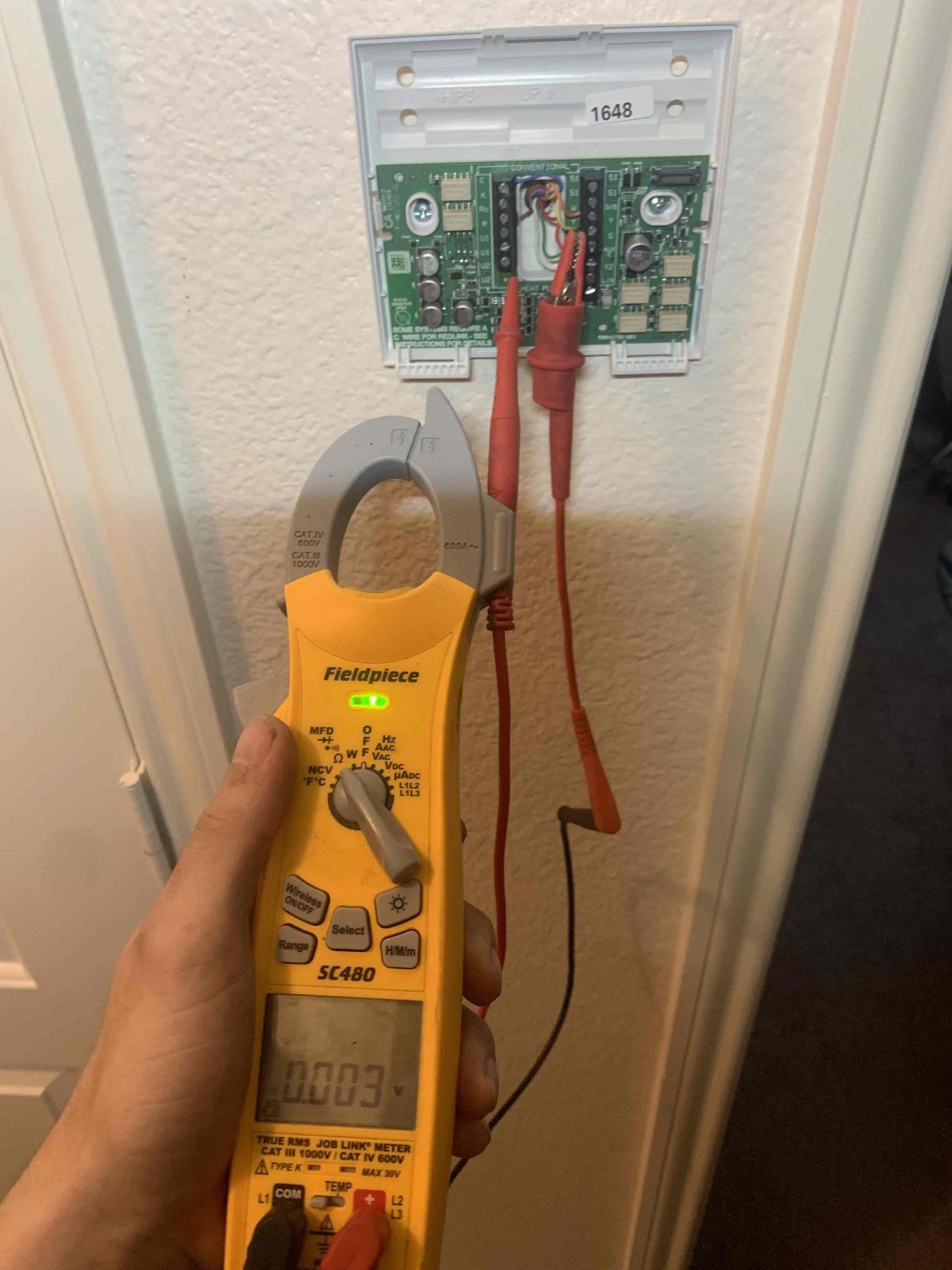Arrived on site found thermostat powered down. Removed thermostat and found slightly loose common wire and tightened it up. Proceeding to the attic unit I found a blown fuse. All the symptoms of a short are present so I extensively searched for low voltage short and could not find one. Replaced fuse and unit powered on without issue and continued to run for 20 minutes. Discussed with homeowner that this is an intermittent issue which tells me the issue has to be with a circuit board having ruled out a short. The thermostat or the outdoor control board could be causing this issue, but the outdoor control board appears to be in good condition and working properly at this time. This leads me to believe that the thermostat is causing this issue. 