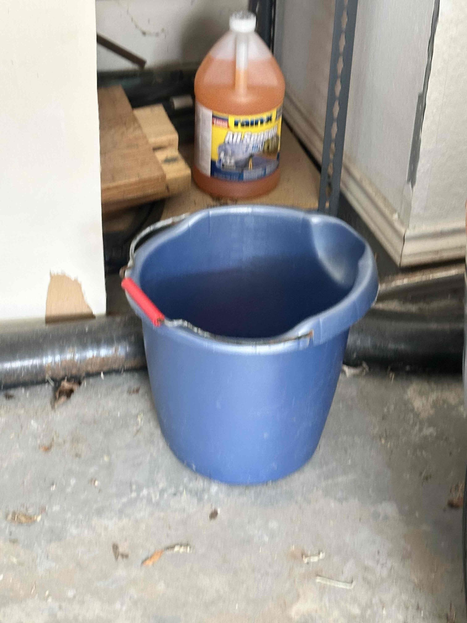 Upon arrival, I found that the primary drain had a slow drain. The primary was empty. I checked for back pressure with my mouth and found it to be clogged. The water was going in to the emergency pan. The water stain came from the keeper screw ,holding the emergency drain to the pan, not being tight. I tightened the screw and used a shop vac and pressure to clear the drain. Also, I used the accumulated water from the leaking pan to flush the drain and followed it with some drain cleaner. It was half a bucket of water. The customer and I spoke about redoing the drain under the sink to allow more access and adding a wet switch to the emergency pan. Customer declined further repairs. 