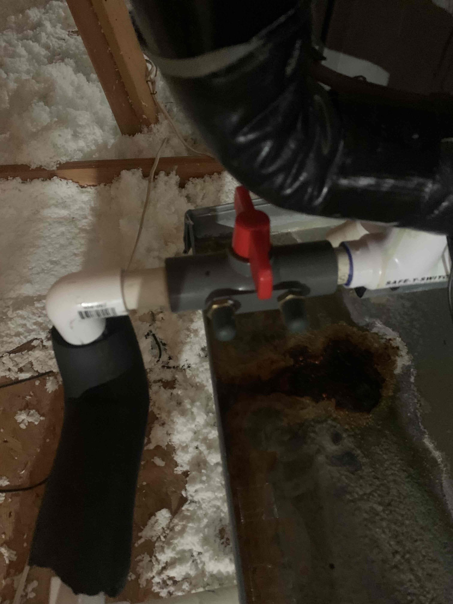 Client stated that the secondary drain pan was having water coming out of it. Upon inspection of the unit in the attic the I found the blow out valve to be closed causing the water to back up into the secondary drain pan. I opened the valve and tested for a clog. Not clog was present at the time of inspection. Unit was cooling upon departure. 