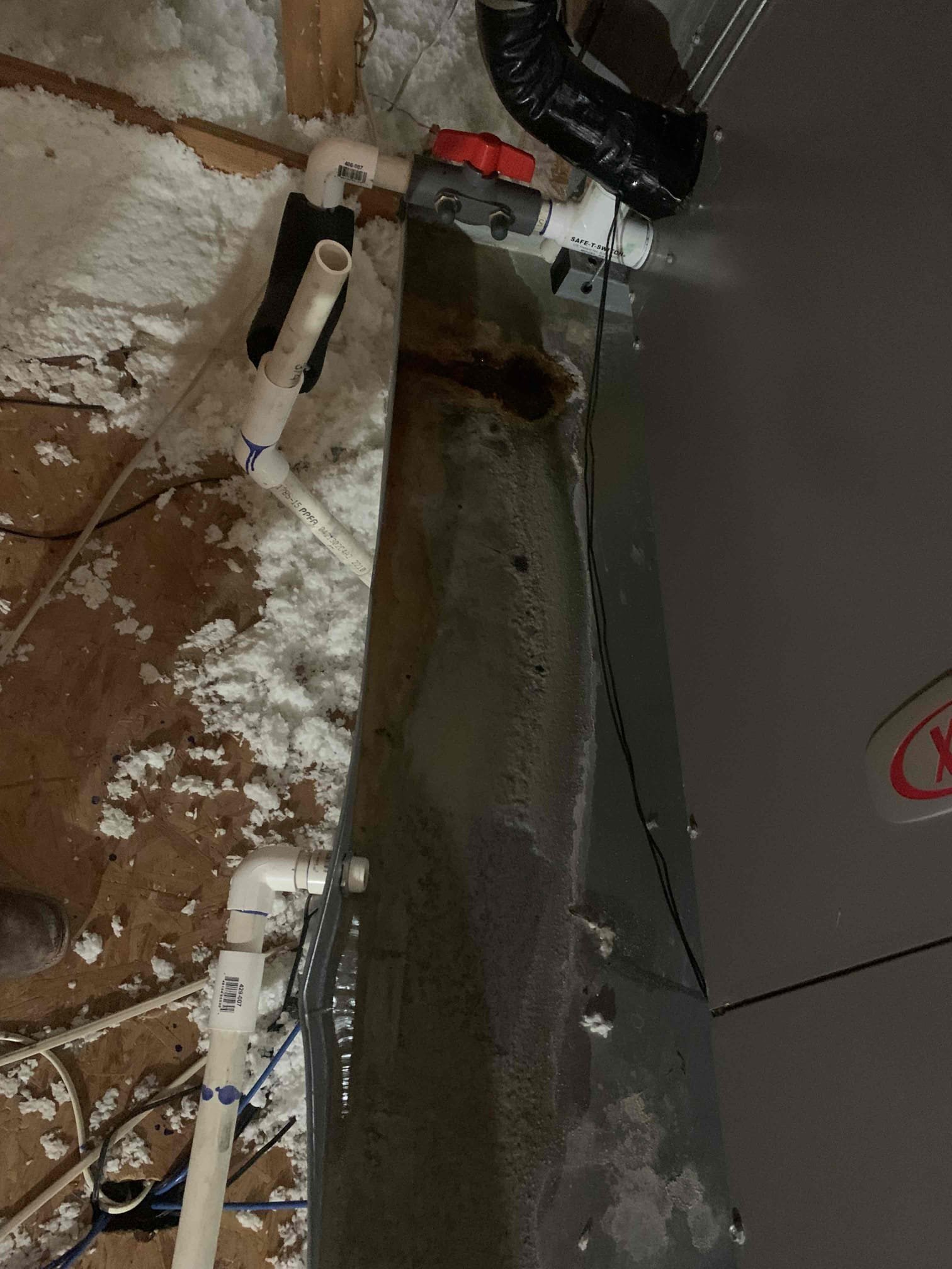 Client stated that the secondary drain pan was having water coming out of it. Upon inspection of the unit in the attic the I found the blow out valve to be closed causing the water to back up into the secondary drain pan. I opened the valve and tested for a clog. Not clog was present at the time of inspection. Unit was cooling upon departure. 