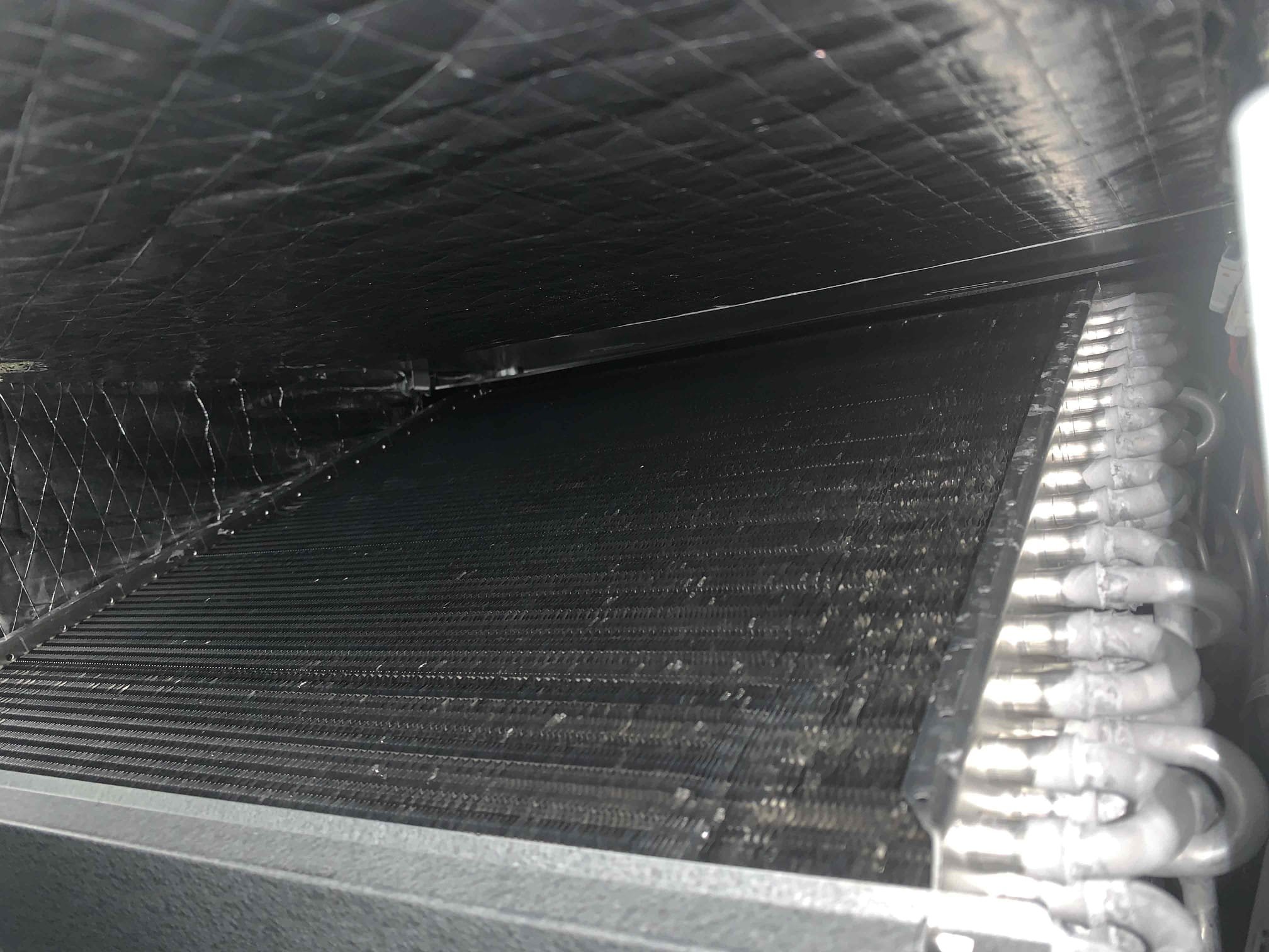 Arrived on site for heating maintenance. Homeowner stated all was well with regards to normal unit operation. However, one kitchen vent was starting to show signs of bacterial growth and another upstairs was showing some signs of water stains around the return at the top of the stairs. I thoroughly inspected around the return grill and found no water only slight signs of water stains on some of the rafters and a box in the attic. Flushed drain line to ensure there were no leaks and I did not find any this leads me to believe the water was not coming from the hvac system and likely coming from the roof. As for the other kitchen vent it was found to not be sealed from attic air and the duct was larger (9”)and a shorter run than all of the other ducts coming off of the supply side of the unit. I sealed around the duct and used panduit straps to restrict the airflow for the time being. Also found closed vent in the kitchen. Opened this vent to reduce airflow to the kitchen vent. Discussed 