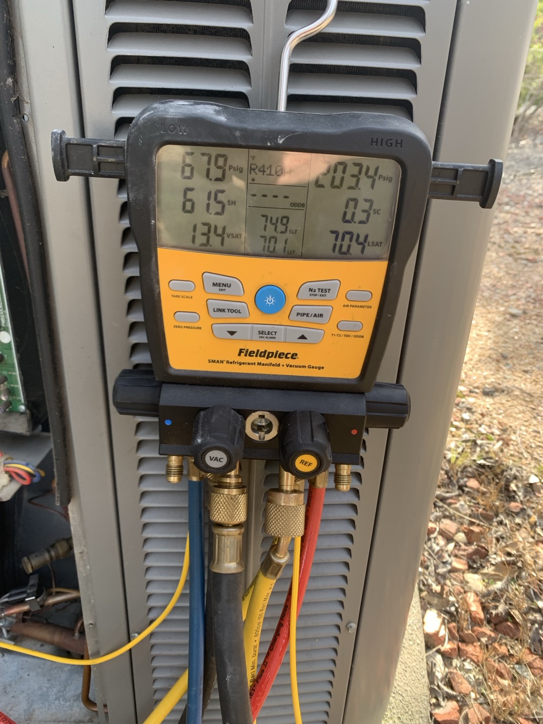 Arrived on site for no heat call. Assisted homeowner in operating Trane  thermostat for other unit that was not having issues. Homeowner stated thermostat had turned off and was unresponsive. Upon inspecting the thermostat I found it was powered on and seem to be cooling. I then tested the drain line with a gallon of water and found no blockage. Upon taking a temperature split I noticed I was only getting about a 10° difference. And then went outside and verified refrigerant pressures and found the low side testing around 60 to 70 psi and high side around 200. I removed the  very dirty filter from the unit and instantly measured a 20° split upon checking pressures. I found 110 on the low side and around 200 on the high side. I then tested zone one damper for the upstairs and zone two for the downstairs and found no issues. Advised homeowner to replace filters every month. Unit in good working order upon departure.