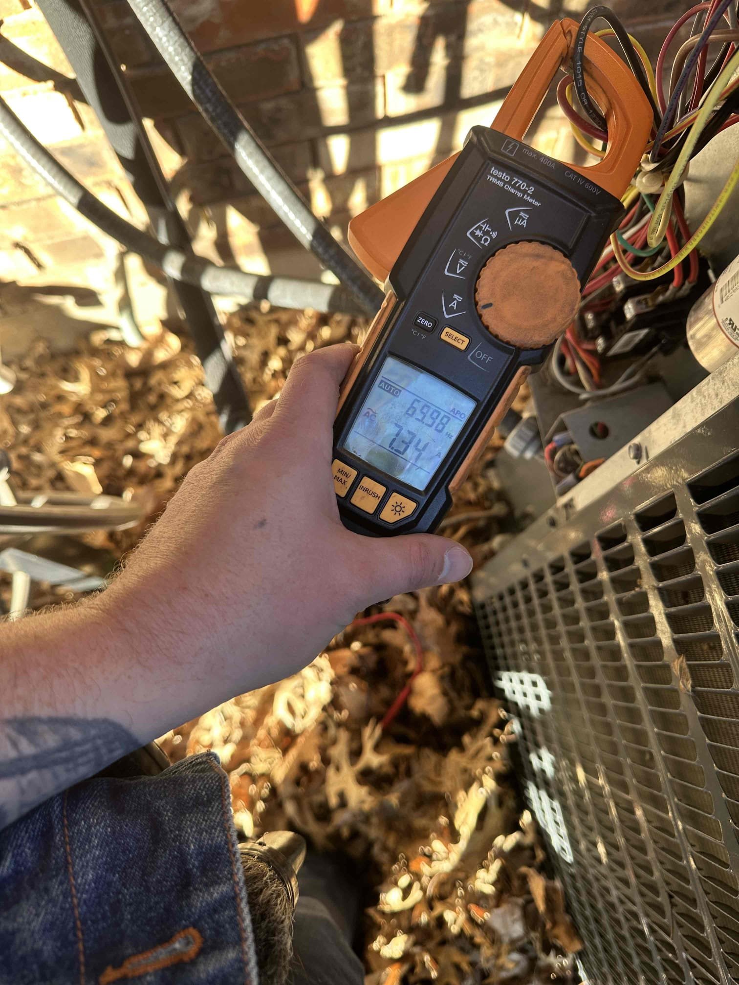 I performed a single heating maintenance on a 2015 heat pump system. I checked amps, capacitors, filter, electrical connections, cleanliness, and safeties. Also, I removed leaves from the top and around the sides of the outdoor unit. I failed to take a picture afterwards. I discovered that the blower has a substantial amount of build up present. This causes higher electric bills and added wear on the motor. I noticed that the unit does not have surge protection either. I presented solutions to the customer, and he declined at the time of service. The system is heating upon departure.