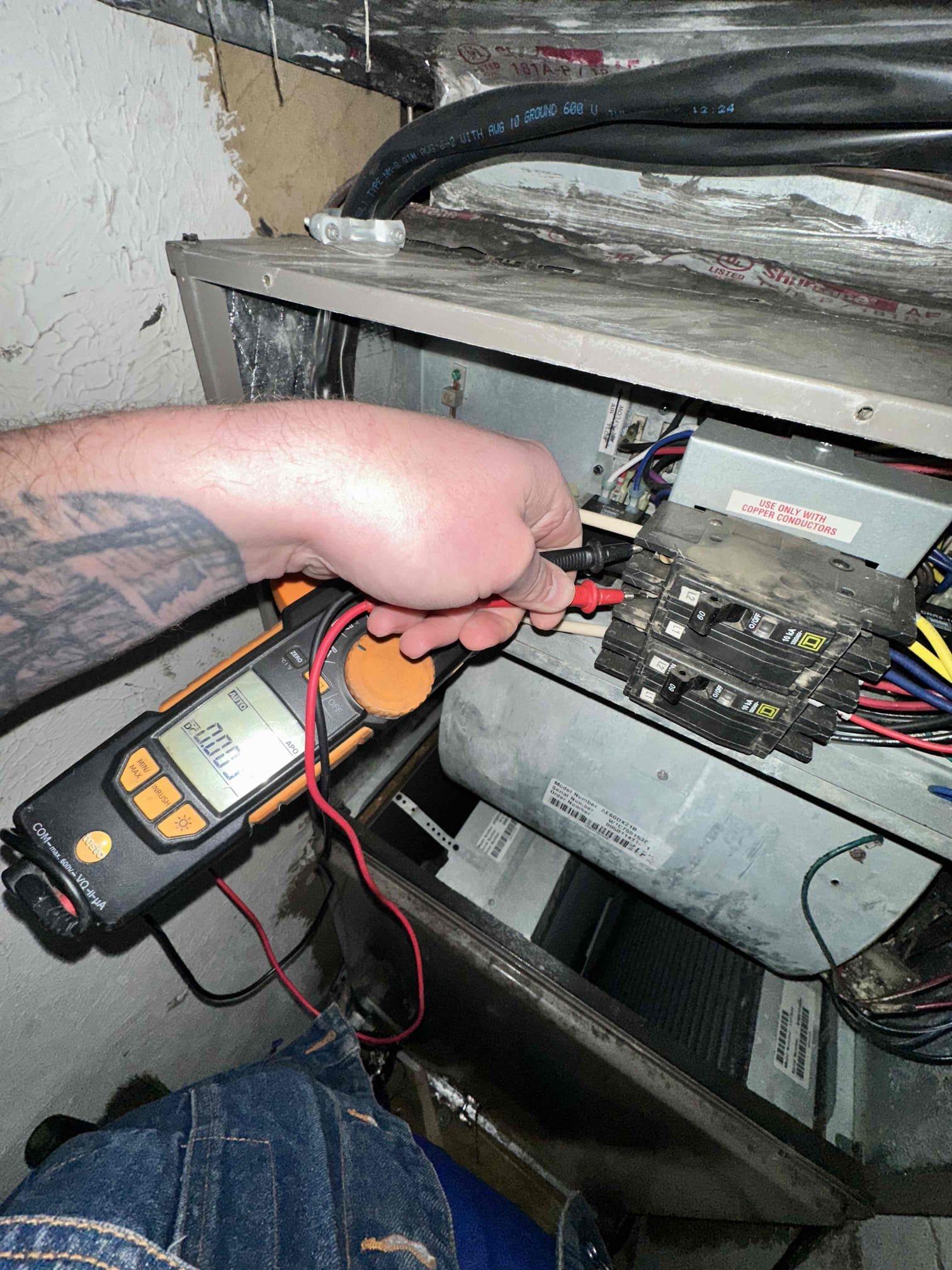 Upon arrival, I found the unit set to emergency heat. I tested the emergency heat and discovered a loss of power to one of the circuits. I went to the main panel and found the breaker off. I turned it on and the electric heat went back to performing at full capacity. I swapped it to heat pump heating and verified that it worked. With the amount of water dripping on the outdoor unit, I did not open the panel to prevent water damage to the components. System is heating in both electric and heat pump heating upon departure. 