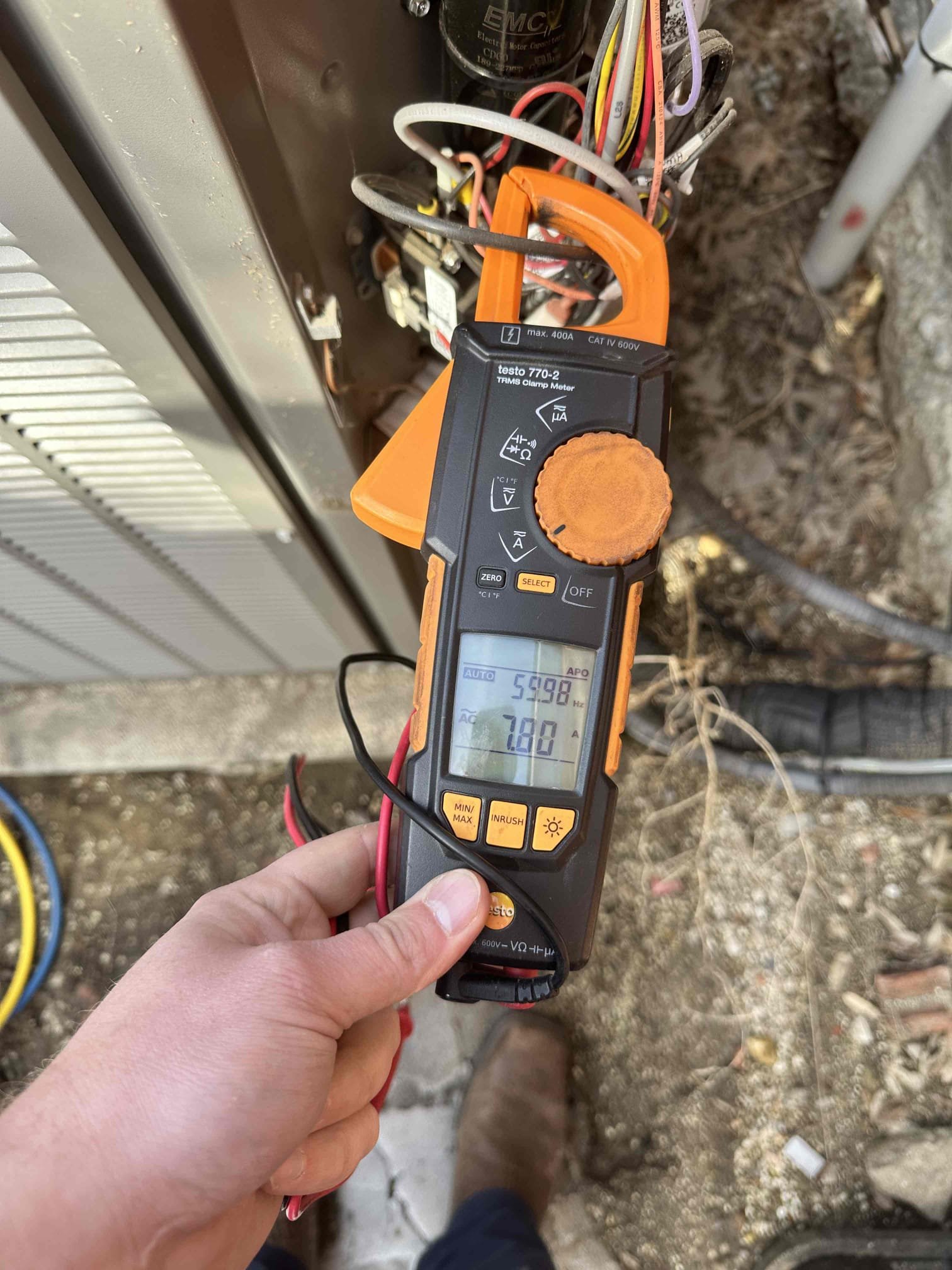 Upon arrival, I discovered that in a call for heating the outdoor unit would begin cooling. I checked my O wire outside, and I found voltage on it when there shouldn’t be. This indicated that there is a short in the wiring. I checked all of the spare wires to common with all of the wires unhooked from the defrost board. They all had voltage on them with them not being used at the airhandler. This narrowed my search to the wire going to the outdoor unit. I could not locate an obvious short, and I even checked the conduit outside that had water in it. I completely removed the conduit and checked again. I still found that all of the spare wires are shorted. I wired the defrost board back up and it failed. I unhooked O to allow it to heat, and I jumped power from Y to the contactor because it quit passing power. I cycled the unit to ensure it would shut off when satisfied. System is temporarily heating with defrost board bypassed and O unhooked. Customer approved rework for warranty defros