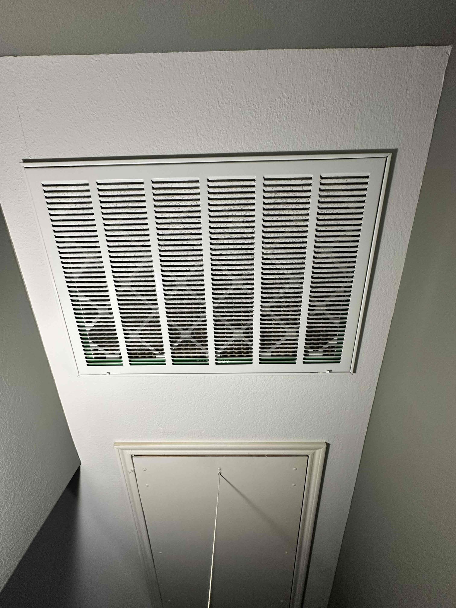 Upon arrival, I discovered the damper working as intended. After investigation, I determined that the damper for downstairs is calibrated to allow pressure to bleed downstairs when upstairs is heating/cooling. The system does not have a bypass to allow pressure relief when one zone is running. I advised the customer that our best bet to address this issue is to set up a dump duct over the stairs. There currently is a duct in the location and it is tied to the upstairs zone by a Y on another duct. We would need to disconnect that duct and seal the Y. The. We would need to run a “home run” duct from the supply side of the system to the preexisting supply boot. We will need to bring 8” , 9” , and 10” collars and ducts due to the duct size being unknown. The office is working on the cost for this service. 