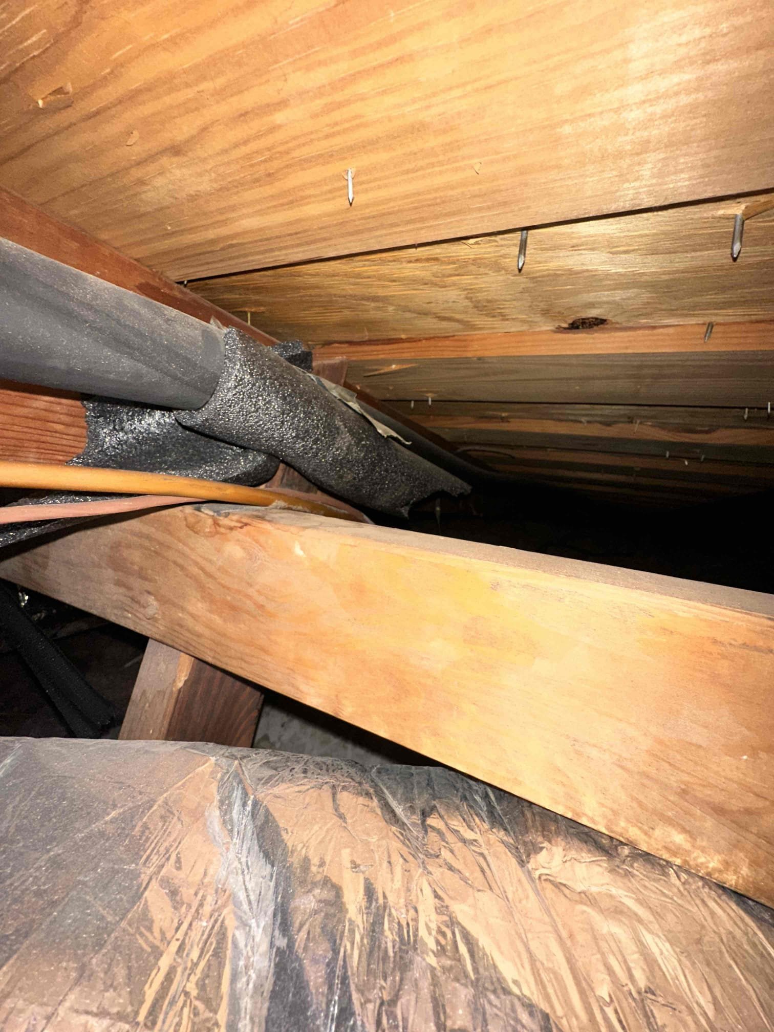 I checked the unit multiple times, and was unable to produce any noises that would be deemed abnormal. I secured the door for the outdoor unit due to the screws being striped. It seems like the customer may be hearing the reversing valve energizing causing pressure to rapidly equalize. System is performing properly at the time of service. Requested the customer to record if the sound comes back.