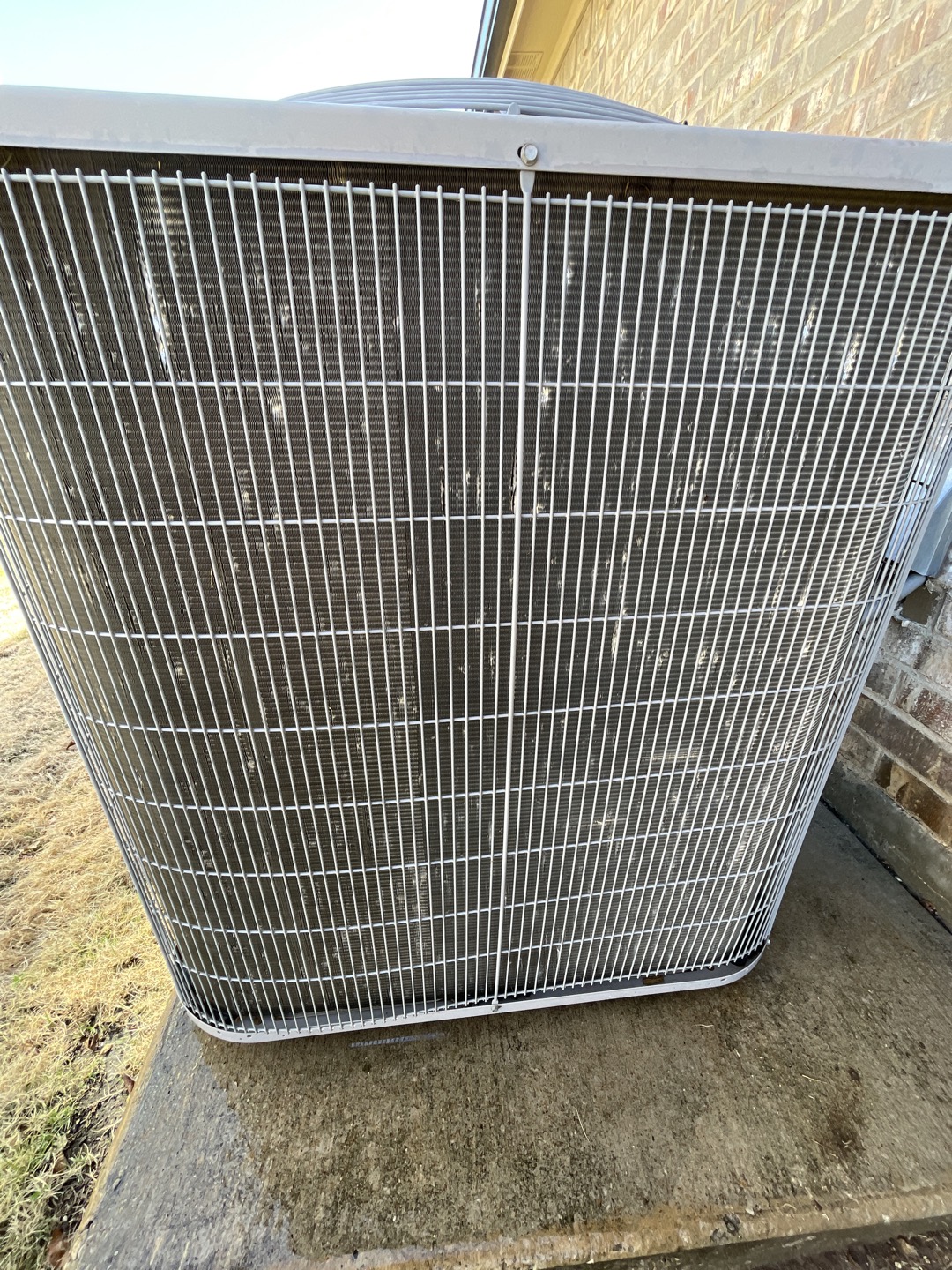 1. Rinsed condenser with water to promote heat exchange and reduce stress on system
2. Visually inspected condenser coil for debris/ dirty.
3. Inspected condenser fan motor.
4. Inspected condenser fan blades.
5. Inspected/ cleaned wiring connections.
6. Tested compressor/ condenser fan motor capacitor.
7. Checked compressor amp draw.
8. Checked condenser fan motor amp draw.
9. Inspected / replaced return filter.
10. Inspected return plenum for debris/ dirty.
11. Inspected evaporator coil.
12. Inspected blower motor/ blower wheel.
13. Checked blower amp draw.
14. Measured temperature differential from supply to return. 20 degrees measured.
15. Inspected drain lines and treated to prevent blockages 

Immediately noticed that the outdoor unit had taken some hail damaged during the storms. Found capacitor was testing within range but a bit low and over 5years showing signs of rust. Capacitor is liable to fail at this point in its life as it is past the expected life span. Also noticed oil 