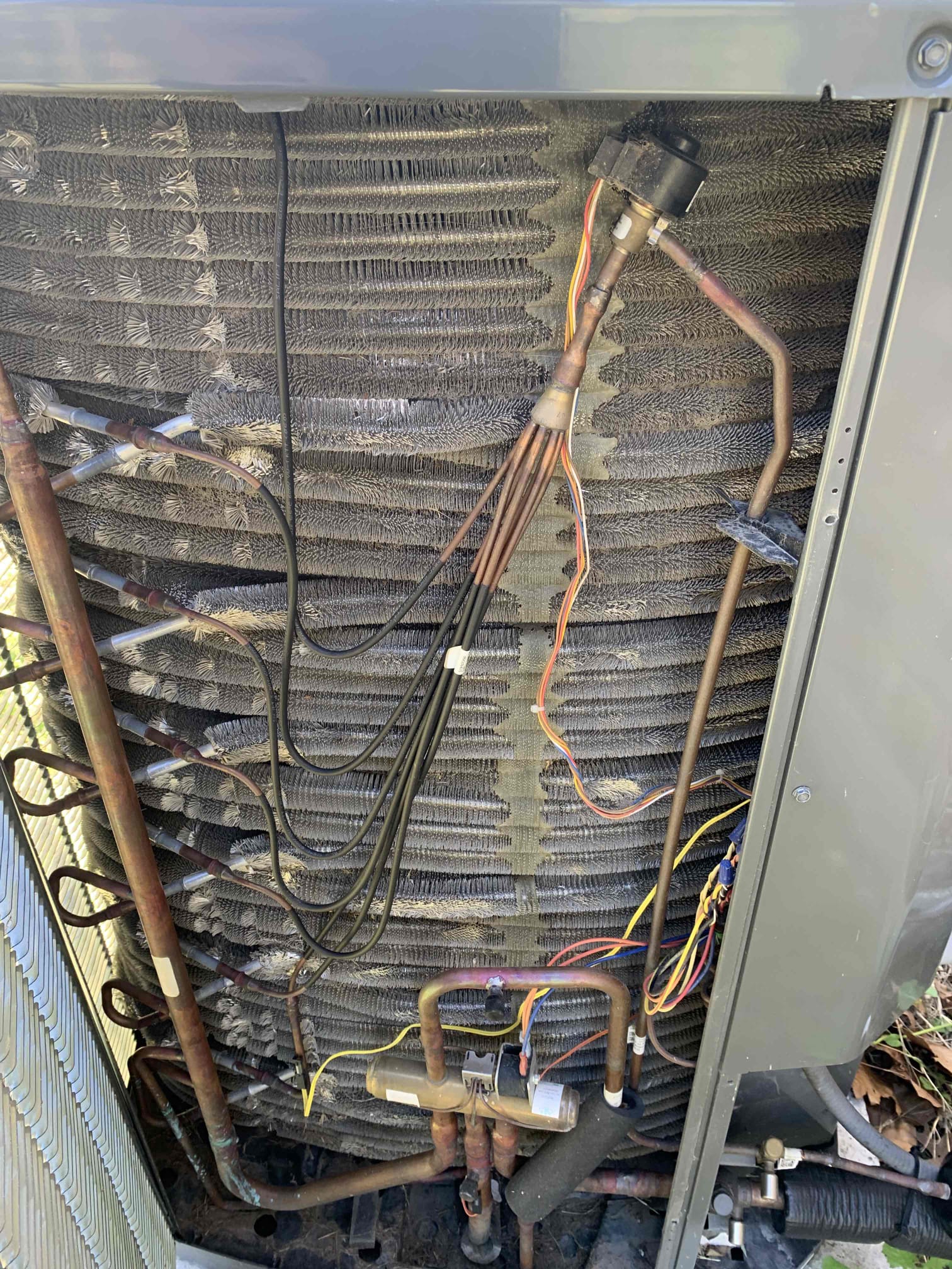 Van Alstyne, TX - Upon completion of my thorough evaluation, I tested all of the electrical components on the inside unit. All tested within manufacturer specifications. I checked for cleanliness of the unit. All was clean. I flushed the drain line with water and total c. No clogs present at this time. Filter needs to be changed. Aprilaire 213 20x25x4. Client did not have filter. 

I inspected the loud noise of the unit outside. I did hear the noise on start up. It is a normal sound coming from the compressor. I tested all electrical components and tested start and run amps of the compressor. All tested within manufacturer specifications. I rinsed the outside unit with water at the time of inspection. 

Unit did not have any type of surge protection. By adding surge protection you can help prevent any damage from lightning strikes and other types of surges in power. 