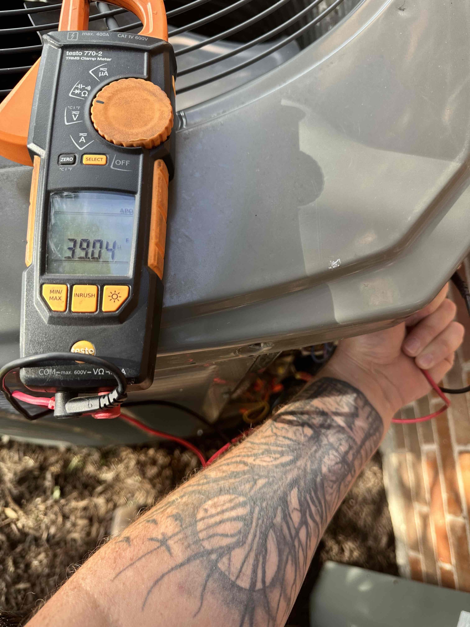 Van Alstyne, TX - I performed a single cooling maintenance on a 2017 heat pump system. I checked amps, capacitors, electrical, cleanliness, drains, and rinsed the outdoor unit. I discovered no mechanical issues during the time of the visit. I noticed that the system could use cleaning to remove oxidation build up in the indoor and outdoor coils. The blower assembly and wheel have growth build up. Due to past issues with components shorting out, I advise that surge protection be installed on the indoor and outdoor equipment.