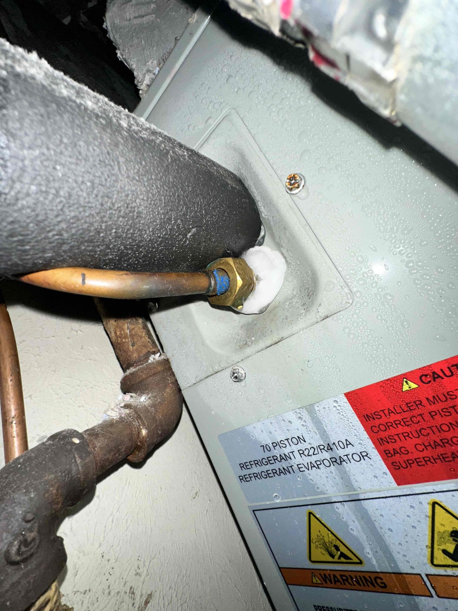 Sherman, TX - Upon arrival, I discover the system in cooling with zero air coming out of the registers. I located the indoor unit. The system is frozen from the evaporator all the way up to the compressor. The compressor is running hot not allowing it to freeze indicating that there is an issue with the refrigerant. We will need to return tomorrow after it has time to thaw. I informed the property owner that getting towels under the system can help prevent potential water damage. Also, I told the property owner to tell the tenet to leave the system off because it will freeze again. 