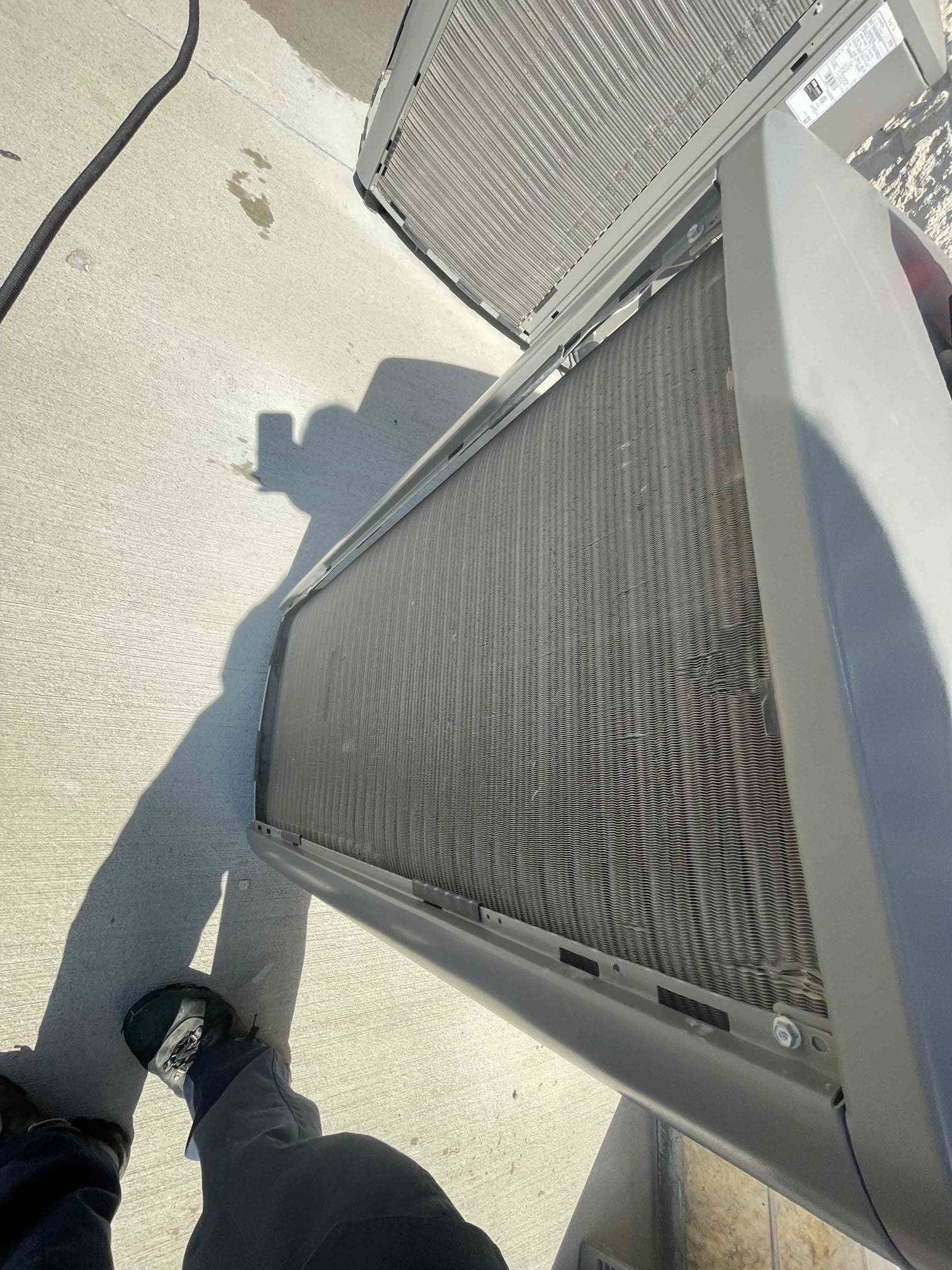 Melissa, TX - 1.  Visually inspected condenser coil for leaks and abnormalities.
2. Inspected condenser fan motor, blades and bearings.
3. Inspected, cleaned, and, tightened wiring connections.
4. Measured capacitance of  compressor/fan motor capacitor.
5. Inspected and measured resistance of contactor
6. Measured compressor current draw.
7. Measured condenser fan motor amp draw.
8. Inspected and replaced return filter.
9. Inspected return plenum for dust or debris.
10. Inspected evaporator coil for cleanliness and oxidation.
11. Inspected blower motor/ blower wheel for dust and debris
12. Measured blower motor current draw.
13. Measured temperature differential from supply to return. 20 degrees measured.
14. Tested drain lines for proper drainage and treated to prevent blockages.
15. Rinsed condenser with water to promote heat exchange and reduce stress on system by removing dust and debris.

Capacitor on both units were testing outside of manufacturer specifications. These capacitors are liable to