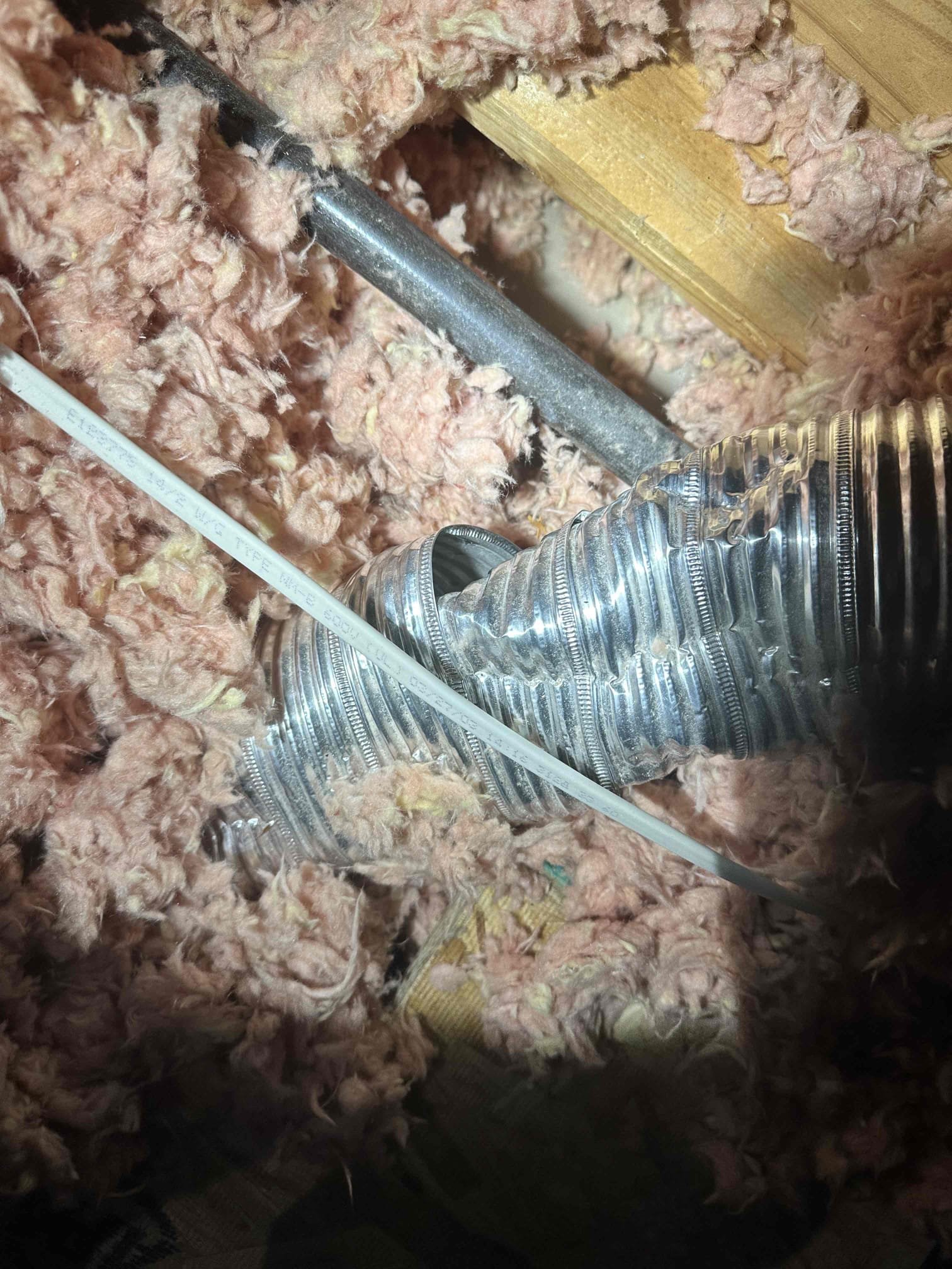 Exhaust pipe for be toilet room is crushed and broken. The only part where the air could flow was covered in insulation. Customer approved cutting apart the vent to open it back up and secure it with metal tape. I provided a service agreement pamphlet to the customer upon departure.