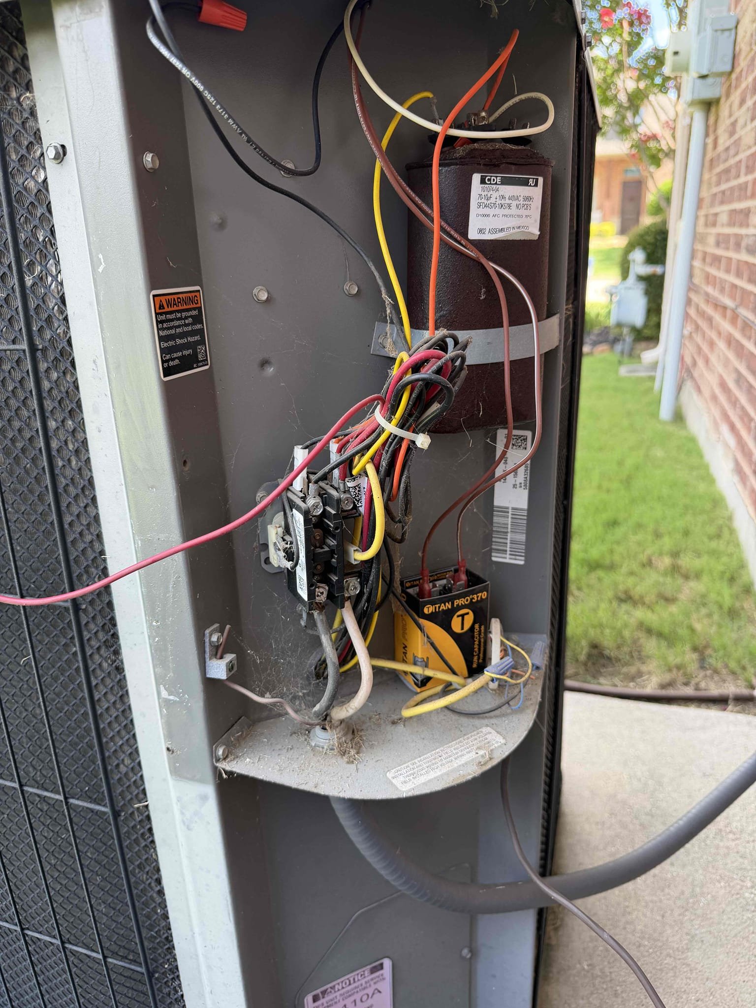 Upon arrival, I found the outdoor fan motor running. It had been replaced. I discovered that the compressor capacitor had ruptured. I presented options for replacement. The client opted to install a Turbo200x. I tested the system afterwards to ensure system is cooling properly. System is cooling upon departure.
