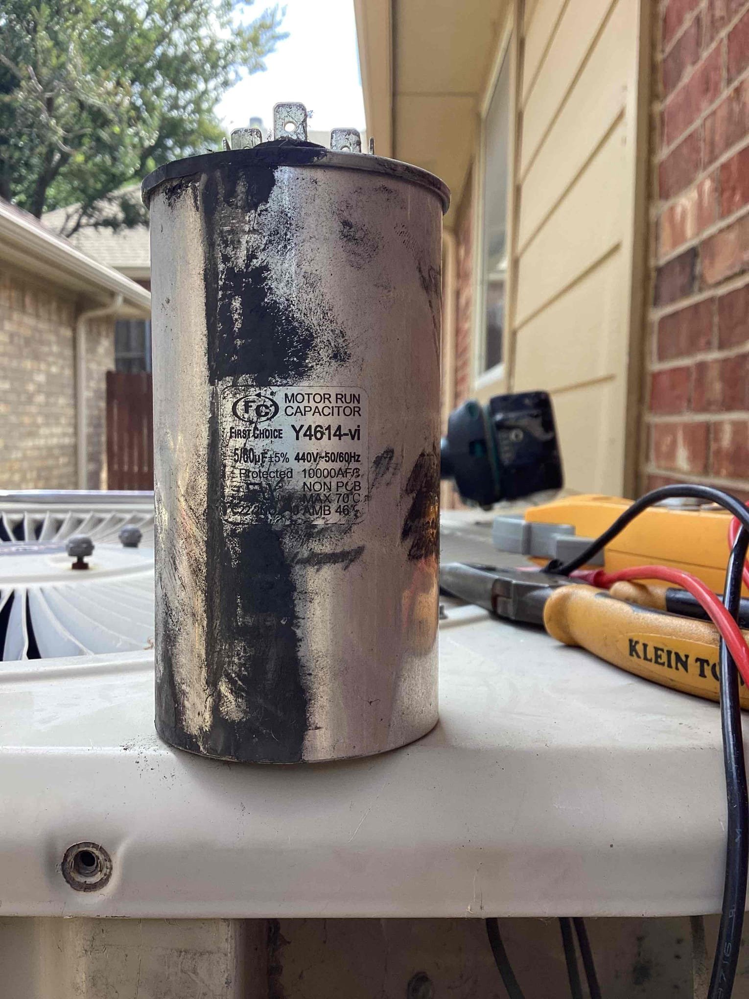 Upon arrival I found that condenser fan motor was running and compressor was not. I found that start capacitor was low reading 45 out of 60. I informed homeowner that I would need to replace start capacitor in order to get compressor to run so that I can further diagnose the issue. I replaced the start capacitor with a 60/7.5. Since compressor was grounded, I removed new capacitor and did not charge. Homeowner for this capacitor. Replaced old capacitor back into outdoor unit.I restored power to condenser and then found that compressor was grounded. I would recommend full system replacement due to the age and the type of refrigerant. The age of the system is 20 years old. This system is a R 22 refrigerant.