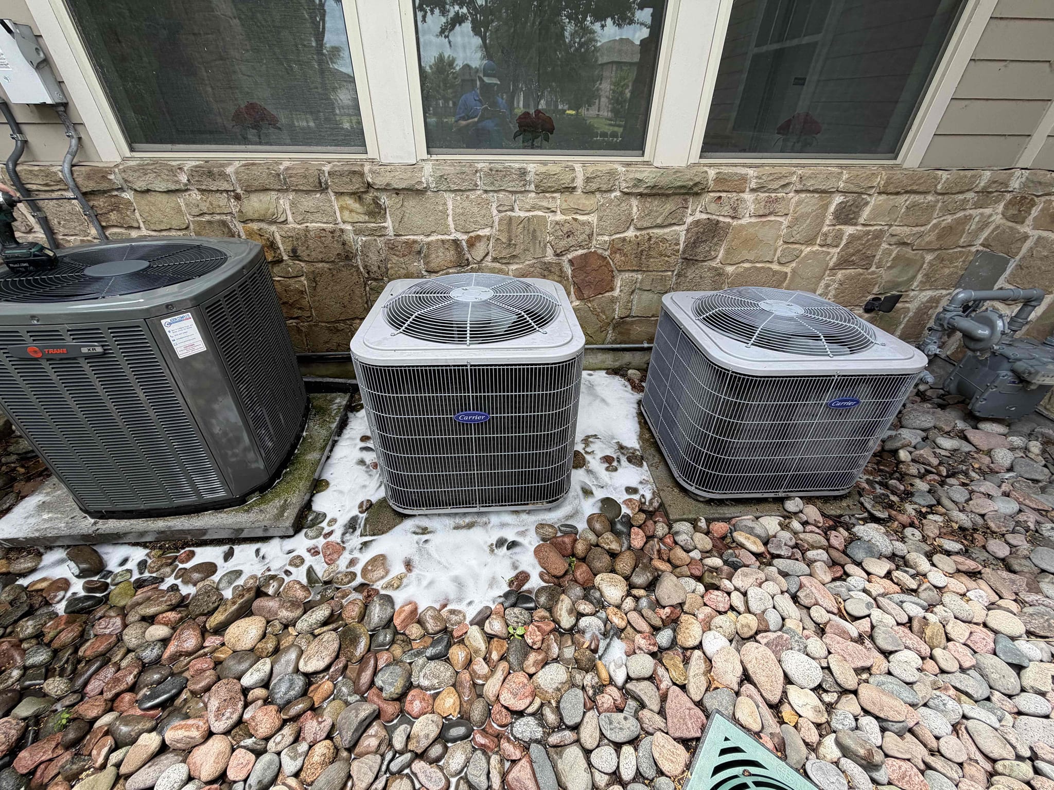 Allen, TX - We performed a 5 system cooling maintenance on gas systems. We checked amps, capacitors, filters, electrical, drains, and cleanliness. During our thorough evaluation, we discovered that 4 of the 5 outdoor units were full of cottonwood. We got approval to provided chemical cleanings during the visit. The dining room 1 system has a 35/5 capacitor that is out of range and will fail likely before the end of the summer. The main system has a weak 45/5 capacitor, also. We noticed the gym unit was having an issue. The issue was a loose wire at the control board. The systems are cooling upon departure. We emailed the other options and the invoice for the cleanings 